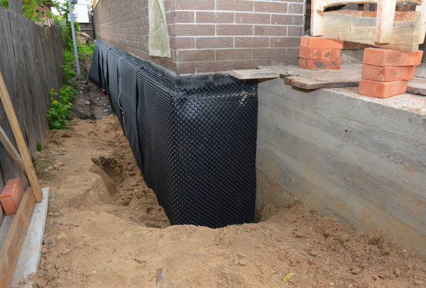 Happy homeowners after waterproofing job in Roswell